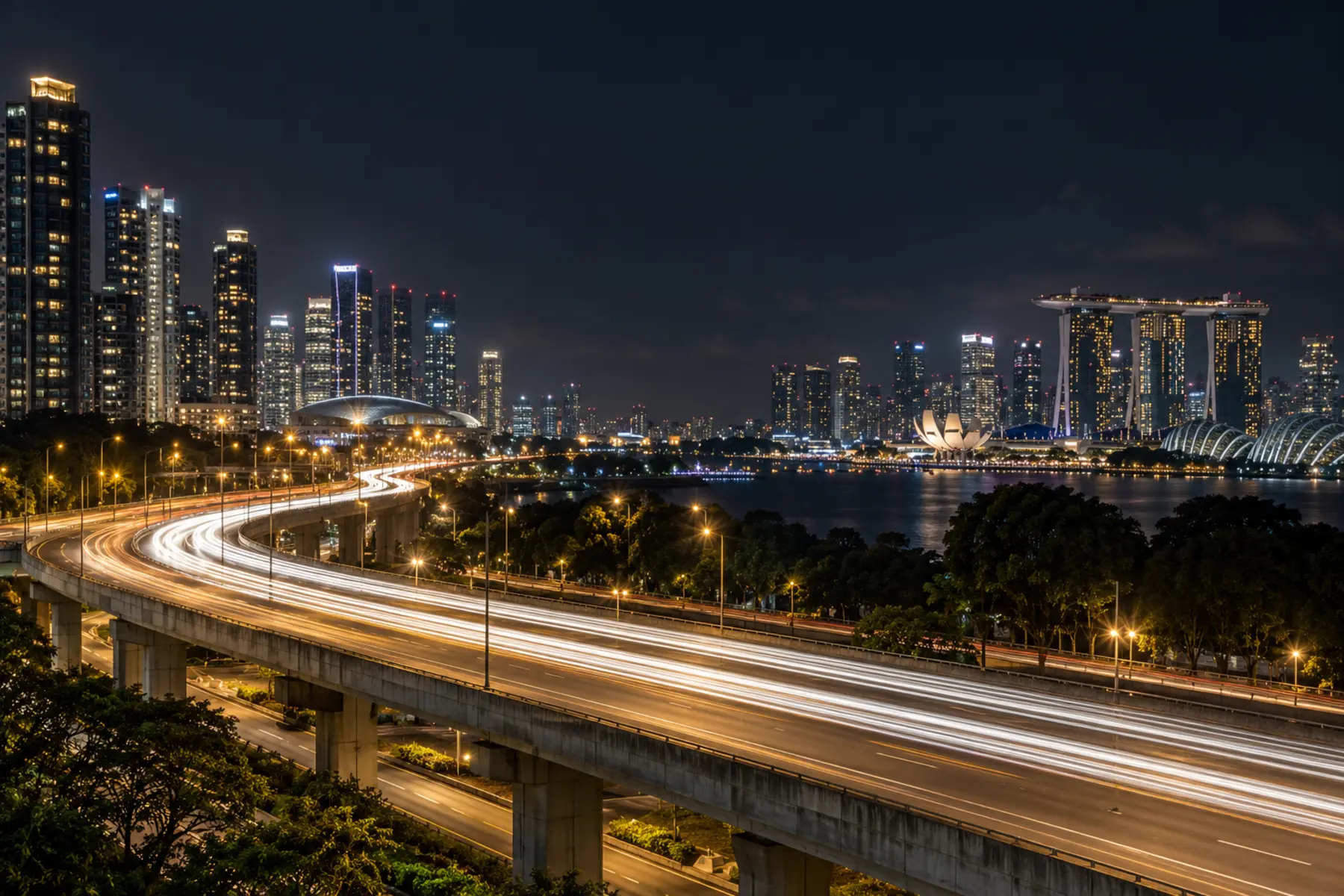 Singapore expressway at night with gold light trails